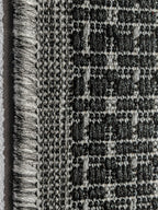 Detalle macro del tejido de alfombra de sisal grafito.