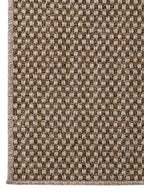 Vista superior de alfombra Special Yute Gold mostrando textura y patrón tejido.